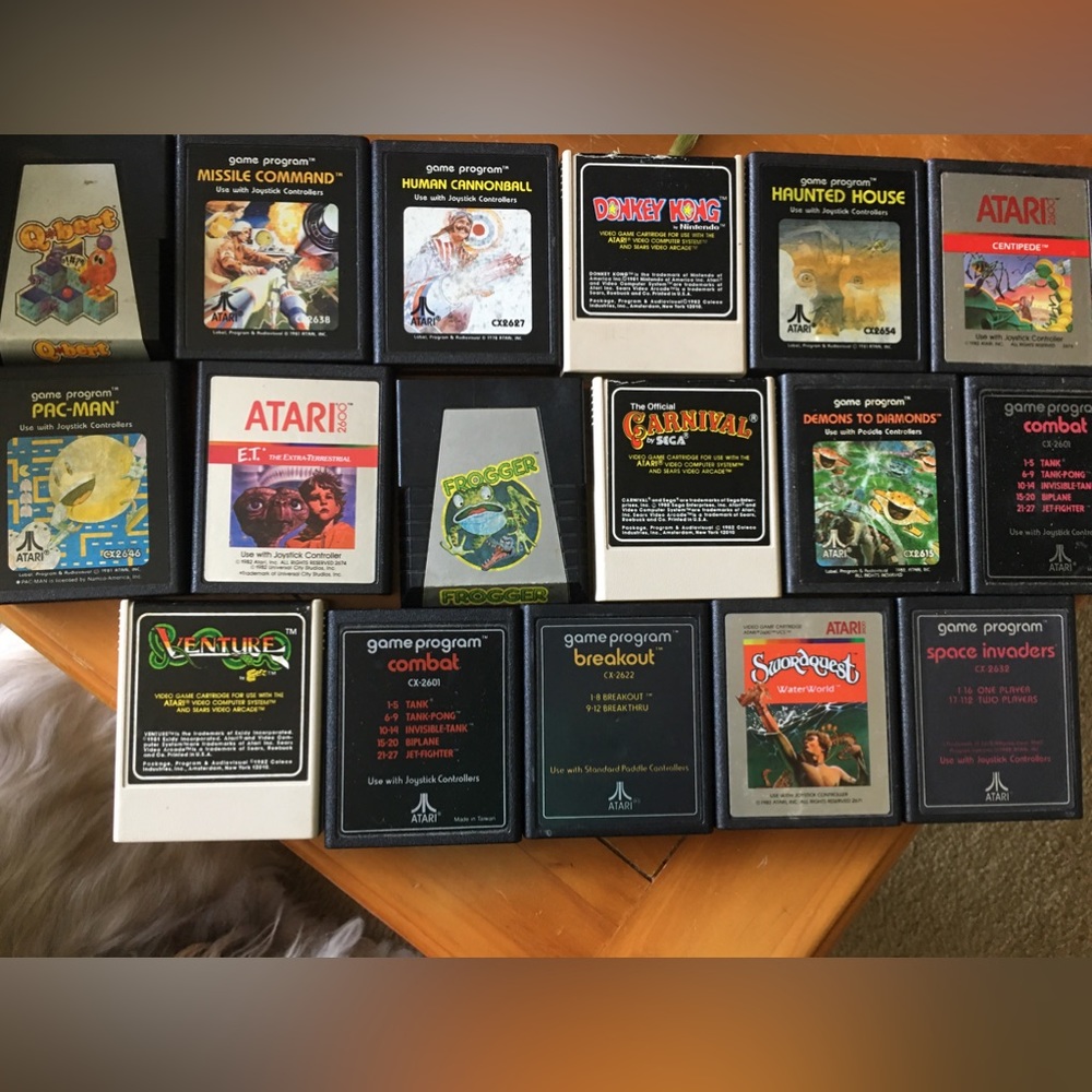 Nintendo machine, games, several remote controllers. Atari games with booklets.